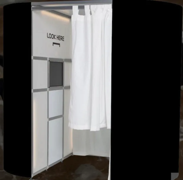 Enclosed Style Photobooth with a white curtain and photo station