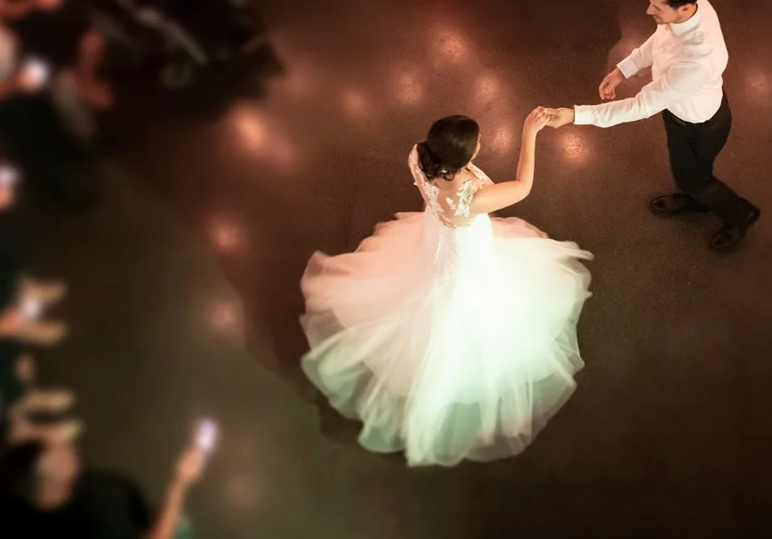 Overhead view of a bride and groom dancing together